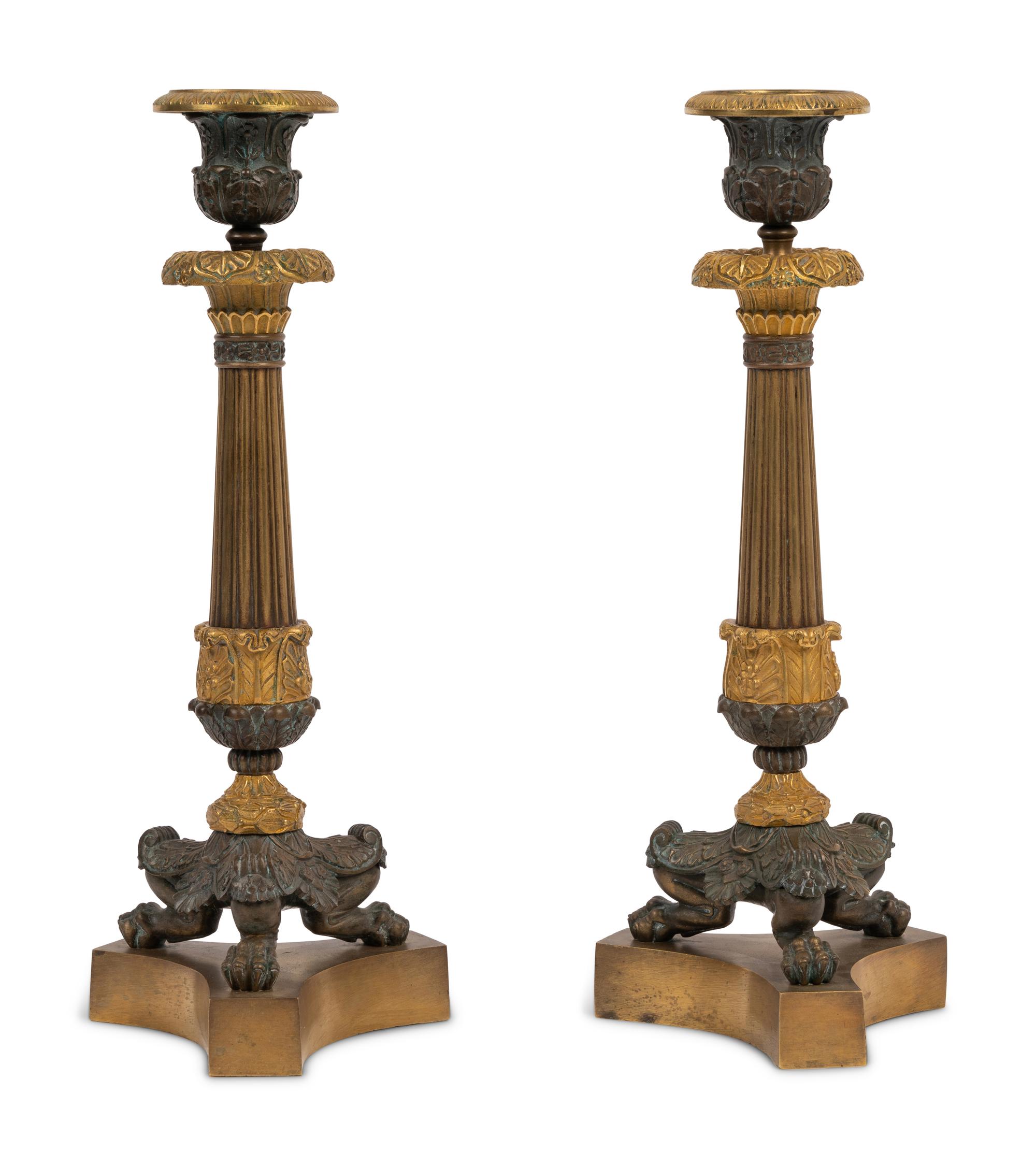A Pair of Neoclassical Style Gilt and Patinated Bronze Candlesticks