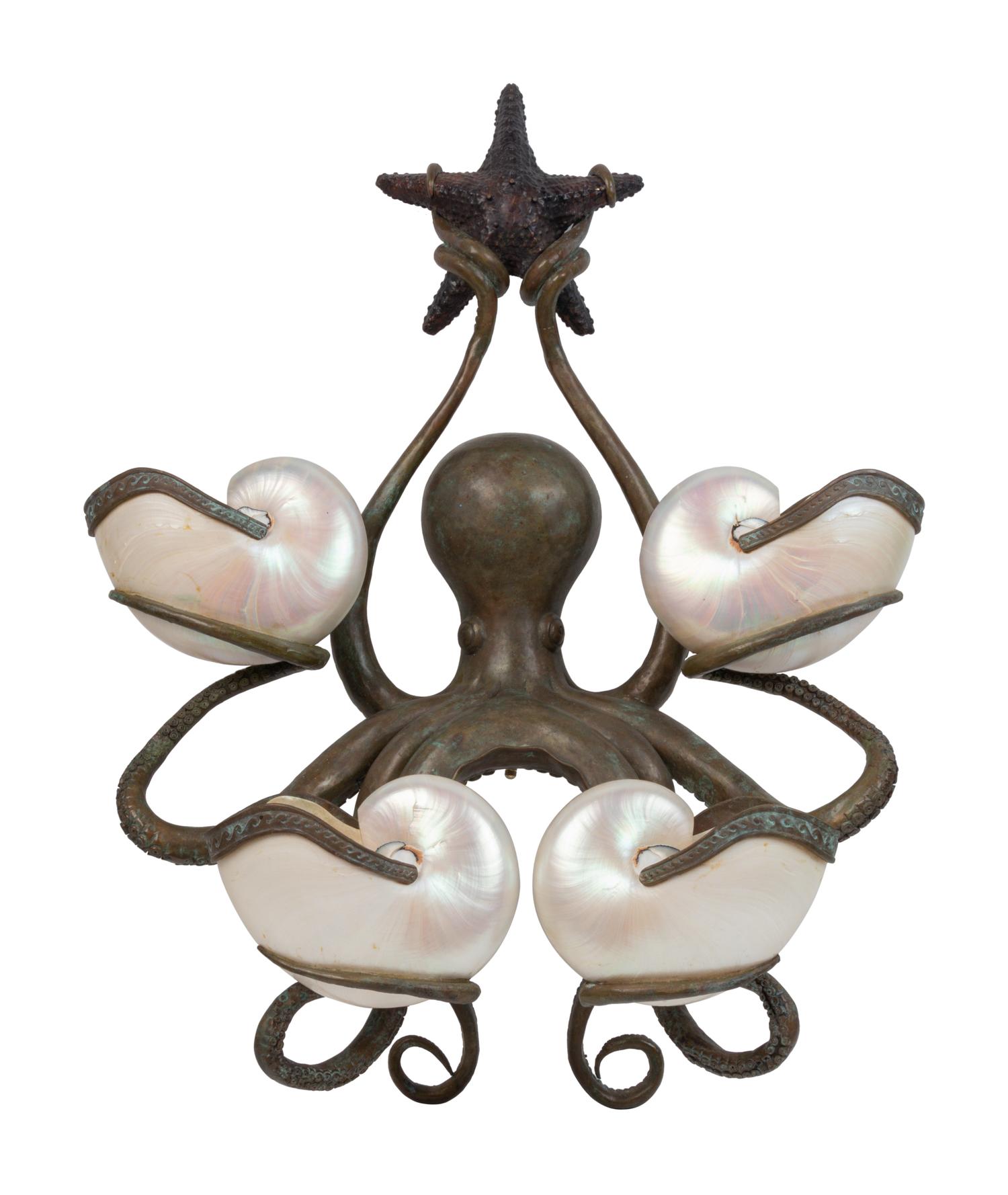 An Iron and Shell Mounted Sconce