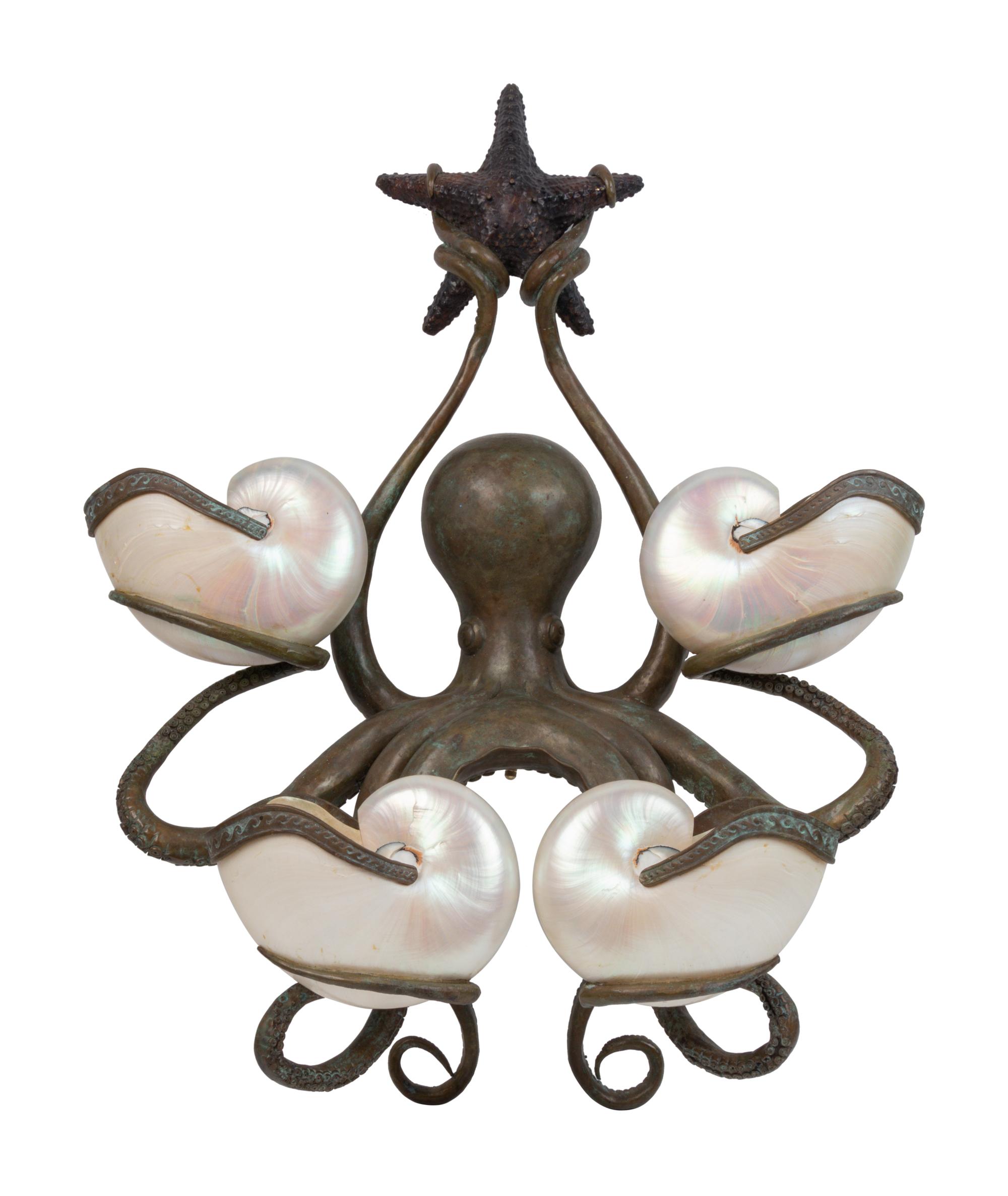 An Iron and Shell Mounted Sconce