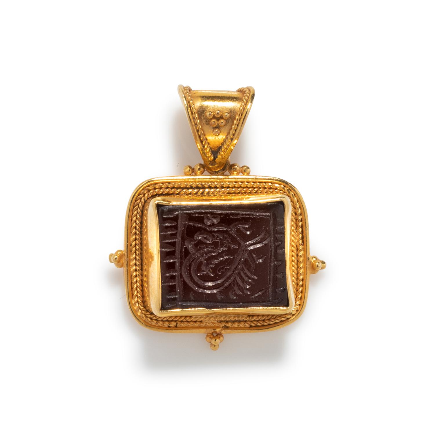 HIGH KARAT GOLD AND SARDONYX INTAGLIO PENDANT
