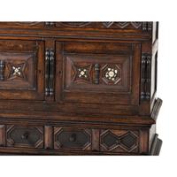 A Flemish Paneled and Molded Oak Chest of Drawers