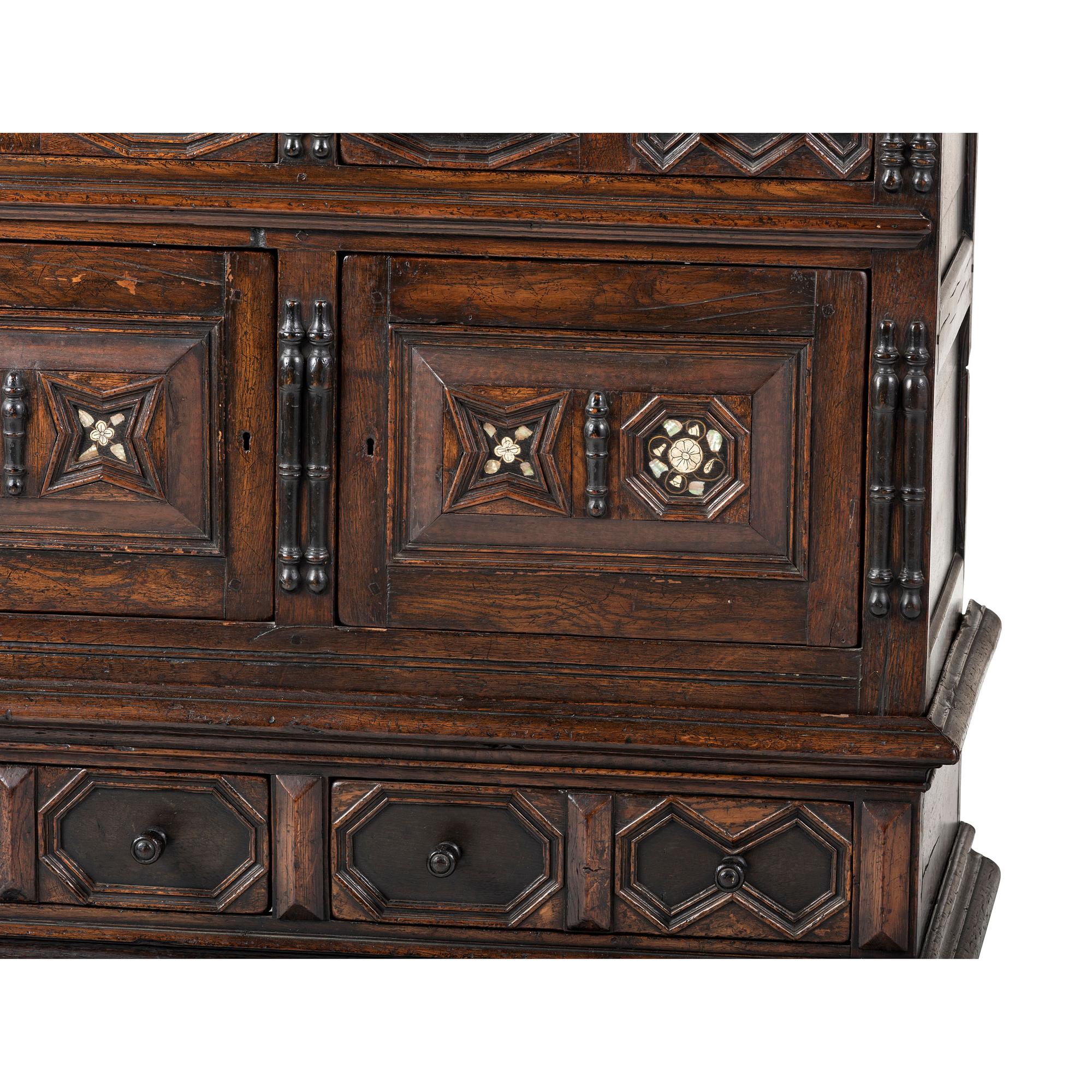 A Flemish Paneled and Molded Oak Chest of Drawers