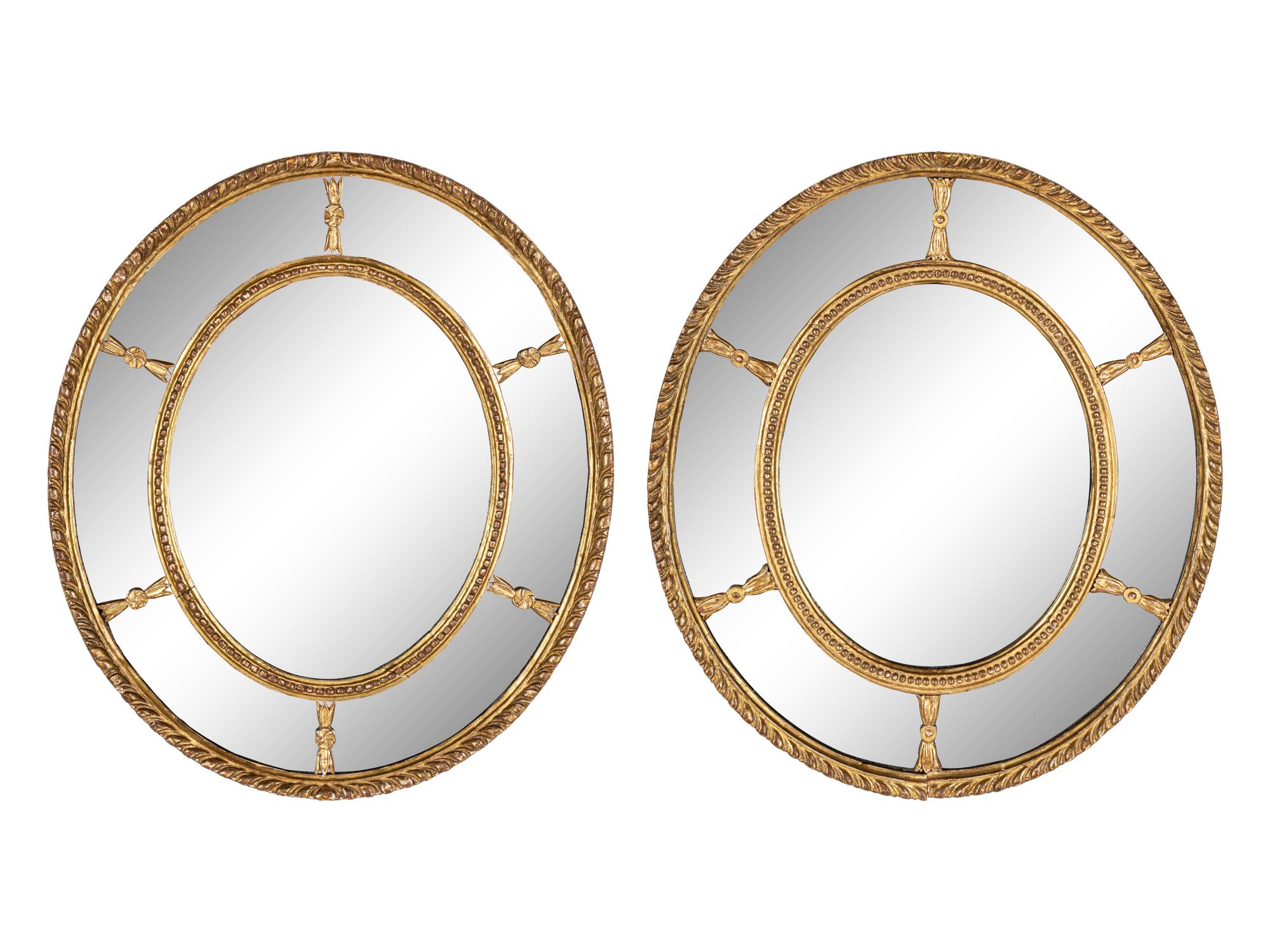A Near Pair of George III Giltwood Oval Mirrors