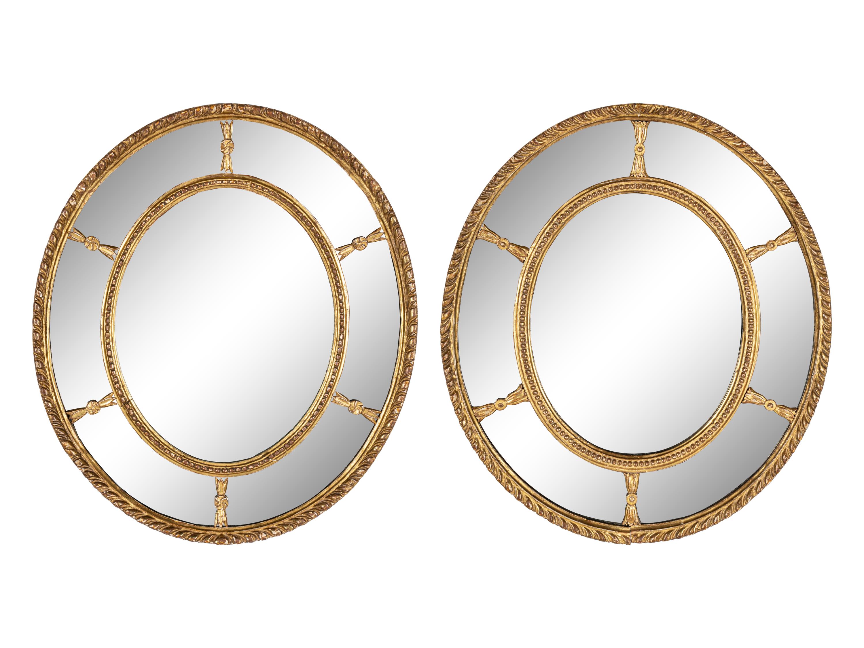 A Near Pair of George III Giltwood Oval Mirrors