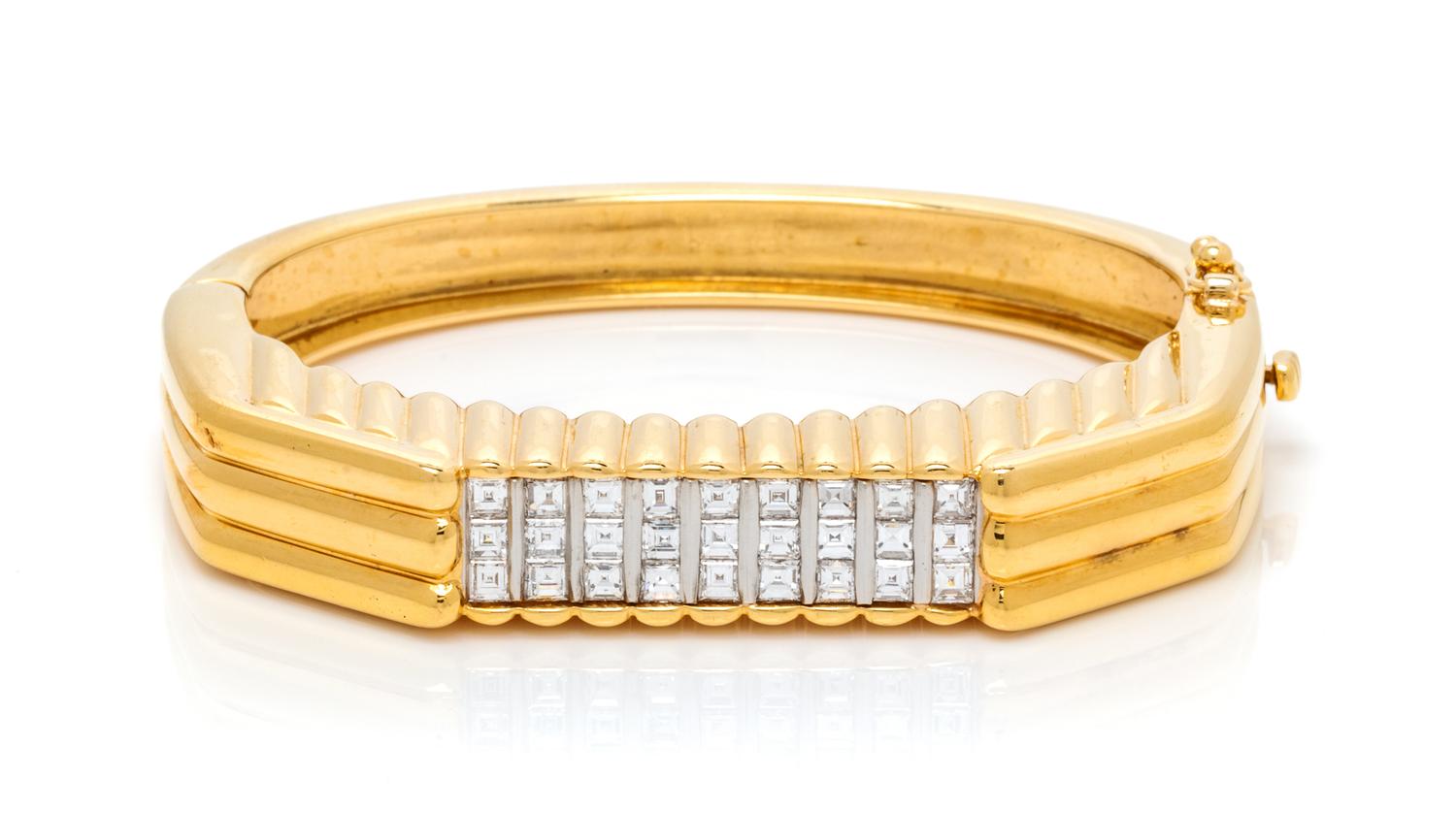 An 18 Karat Yellow Gold, Platinum and Diamond Bangle Bracelet, 34.00 dwts.