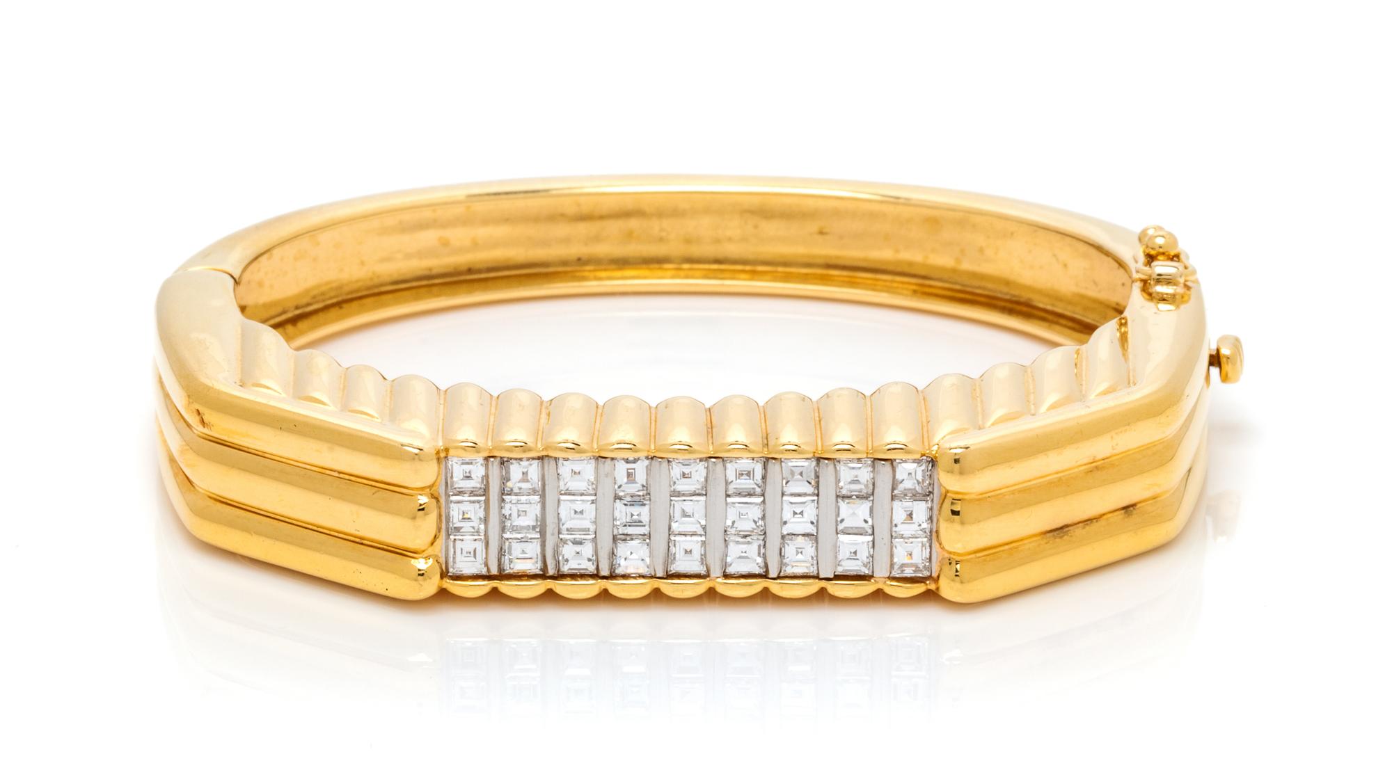 An 18 Karat Yellow Gold, Platinum and Diamond Bangle Bracelet, 34.00 dwts.