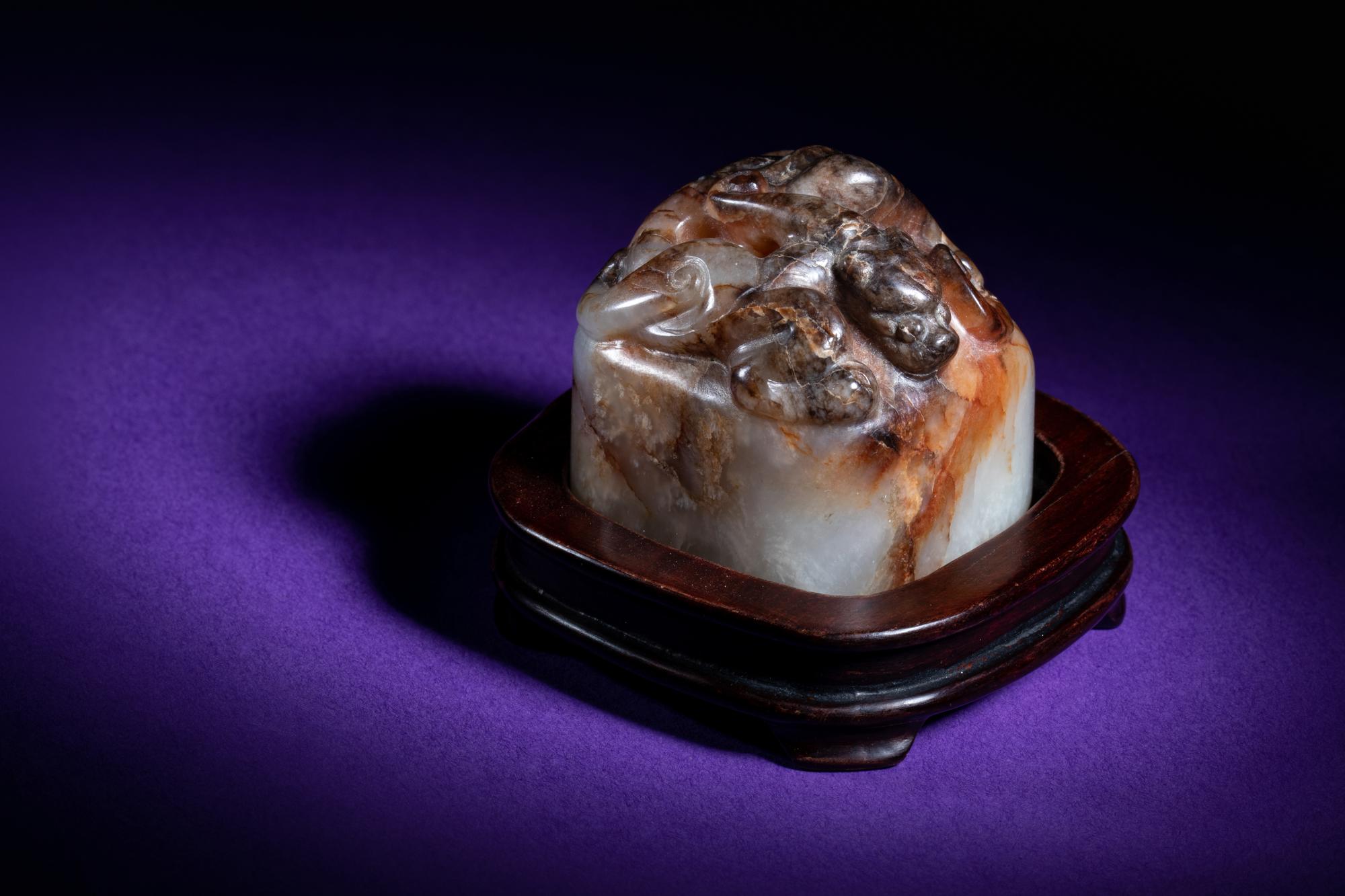 A Chinese White and Russet Jade Seal