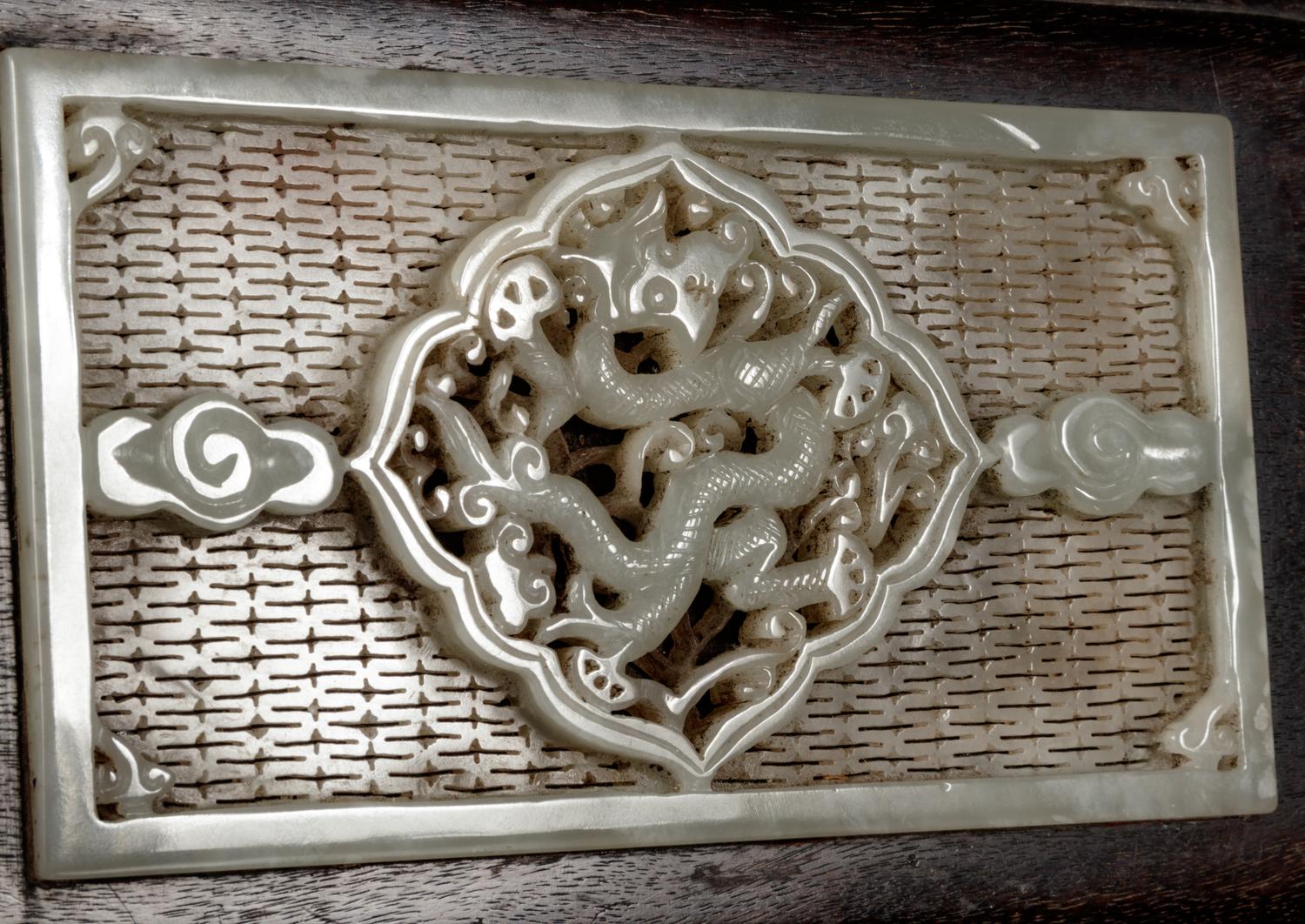 A Chinese White Jade Inset Zitan wood Covered Box