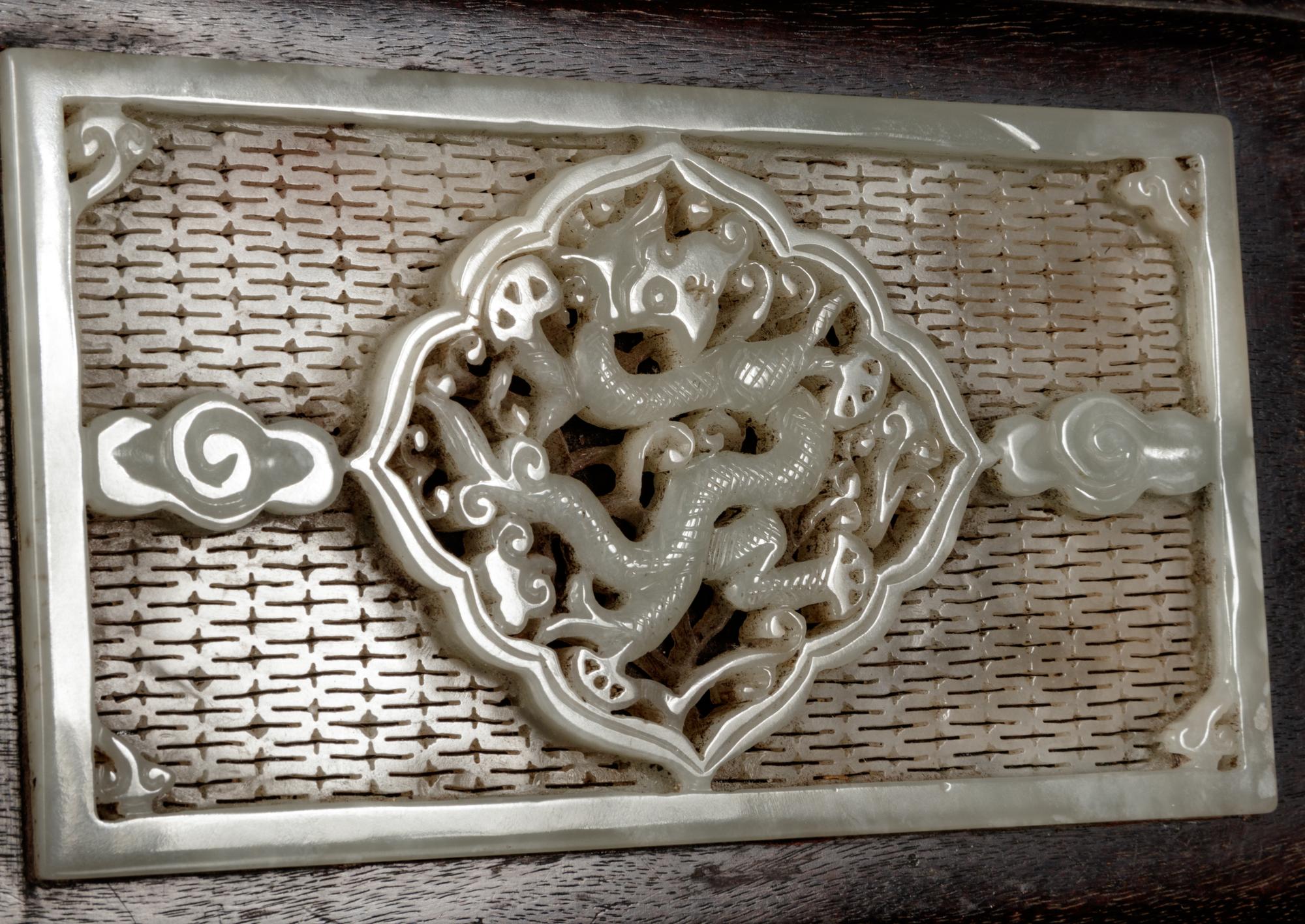 A Chinese White Jade Inset Zitan wood Covered Box