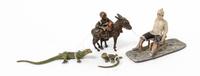 A Group of Four Cold Painted Figures Height of first 3 inches.