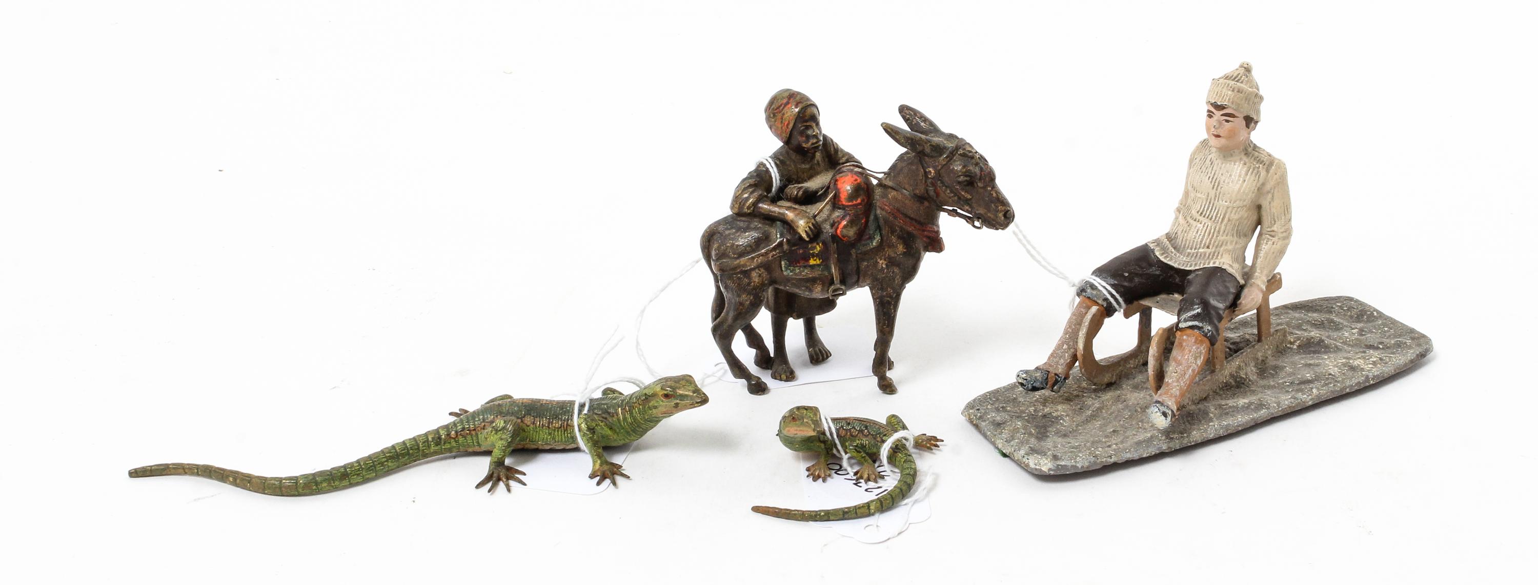A Group of Four Cold Painted Figures Height of first 3 inches.
