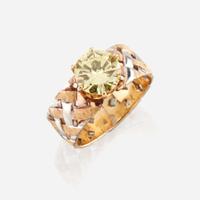A colored diamond and bicolor gold ring