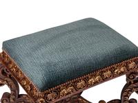 A Pair of Italian Baroque Style Carved and Parcel Gilt Benches