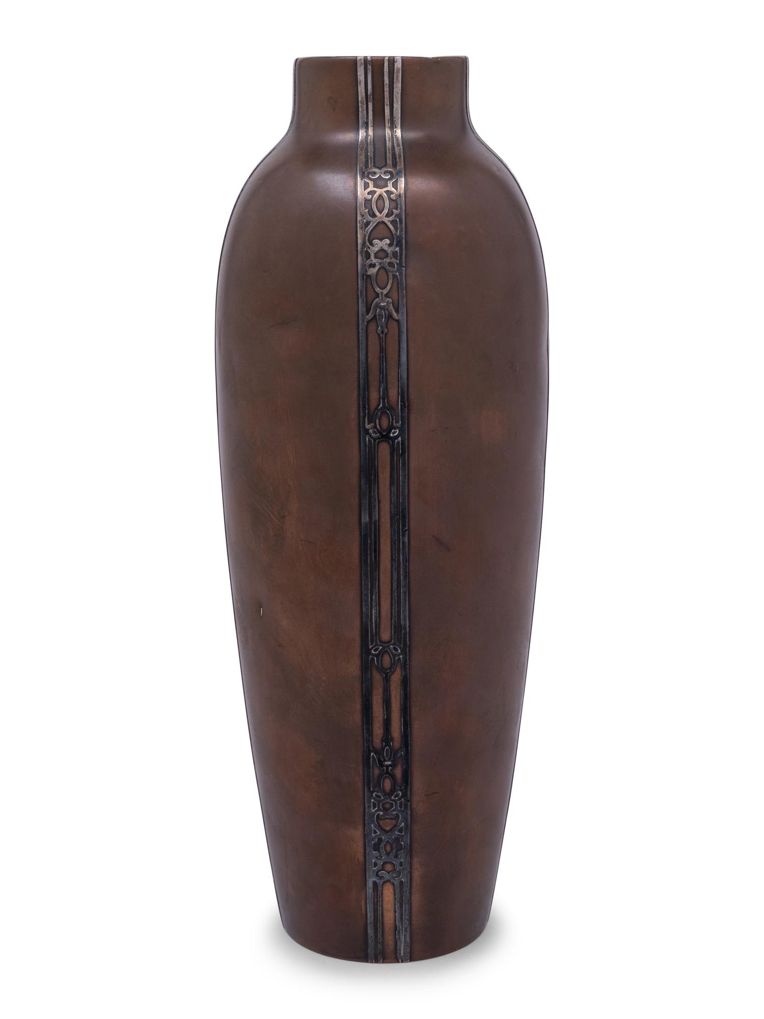 A Heintz Silver on Bronze Base