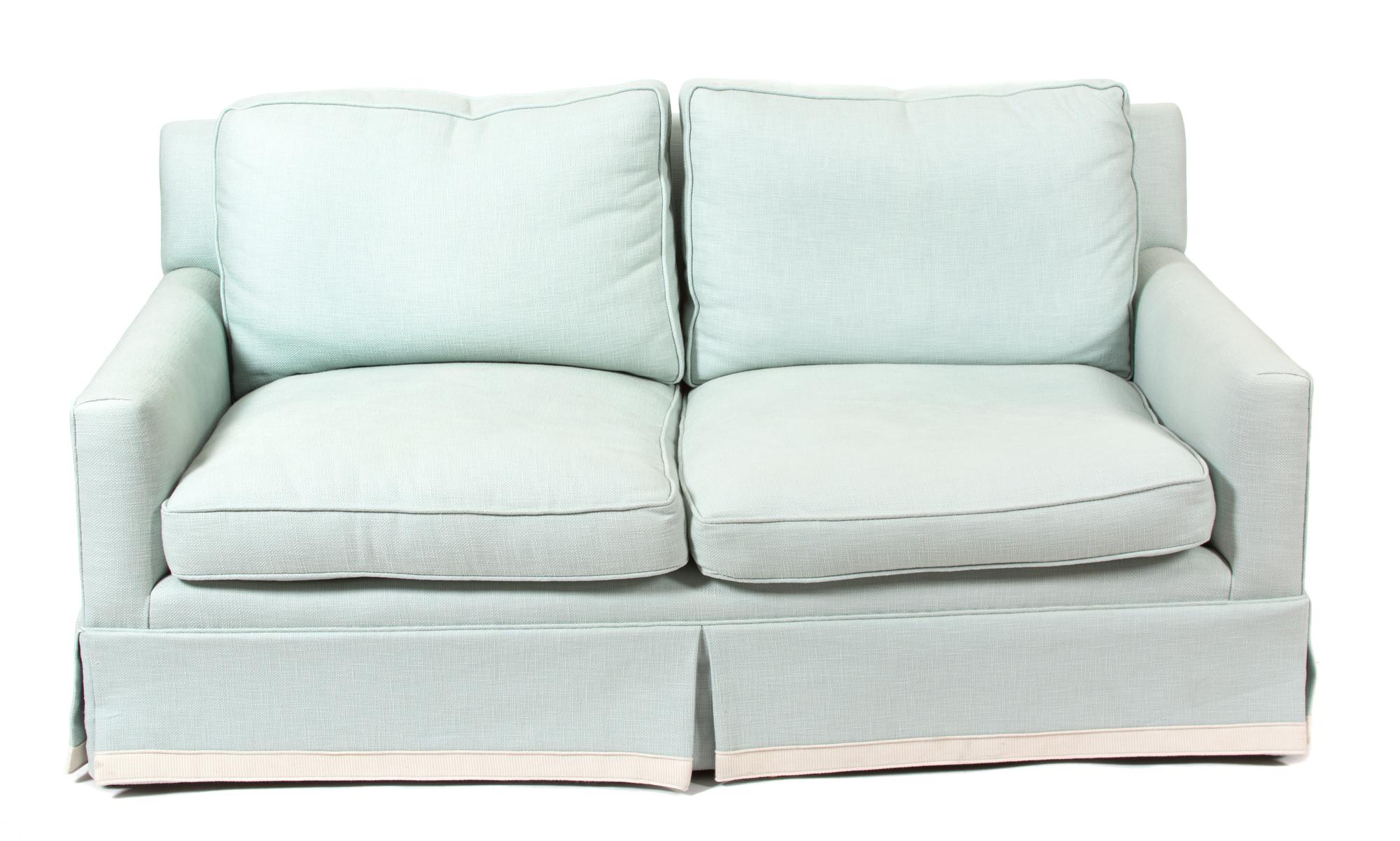 A Contemporary Blue Upholstered Two-Cushion Loveseat — 20TH CENTURY