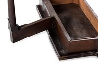 A George III Mahogany Games Table and a Set of Four Queen Anne Style Walnut Dining Chairs