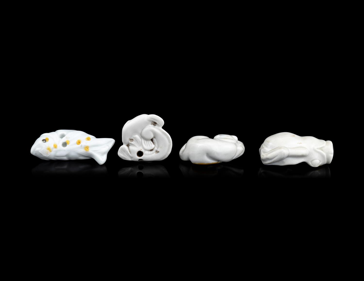 Four Japanese White Glazed Porcelain Animal-Form Netsuke