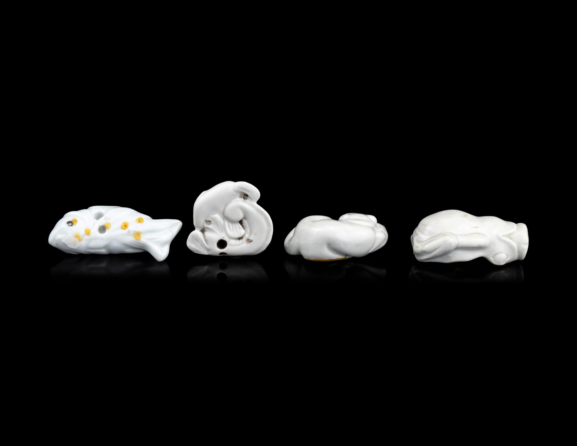 Four Japanese White Glazed Porcelain Animal-Form Netsuke