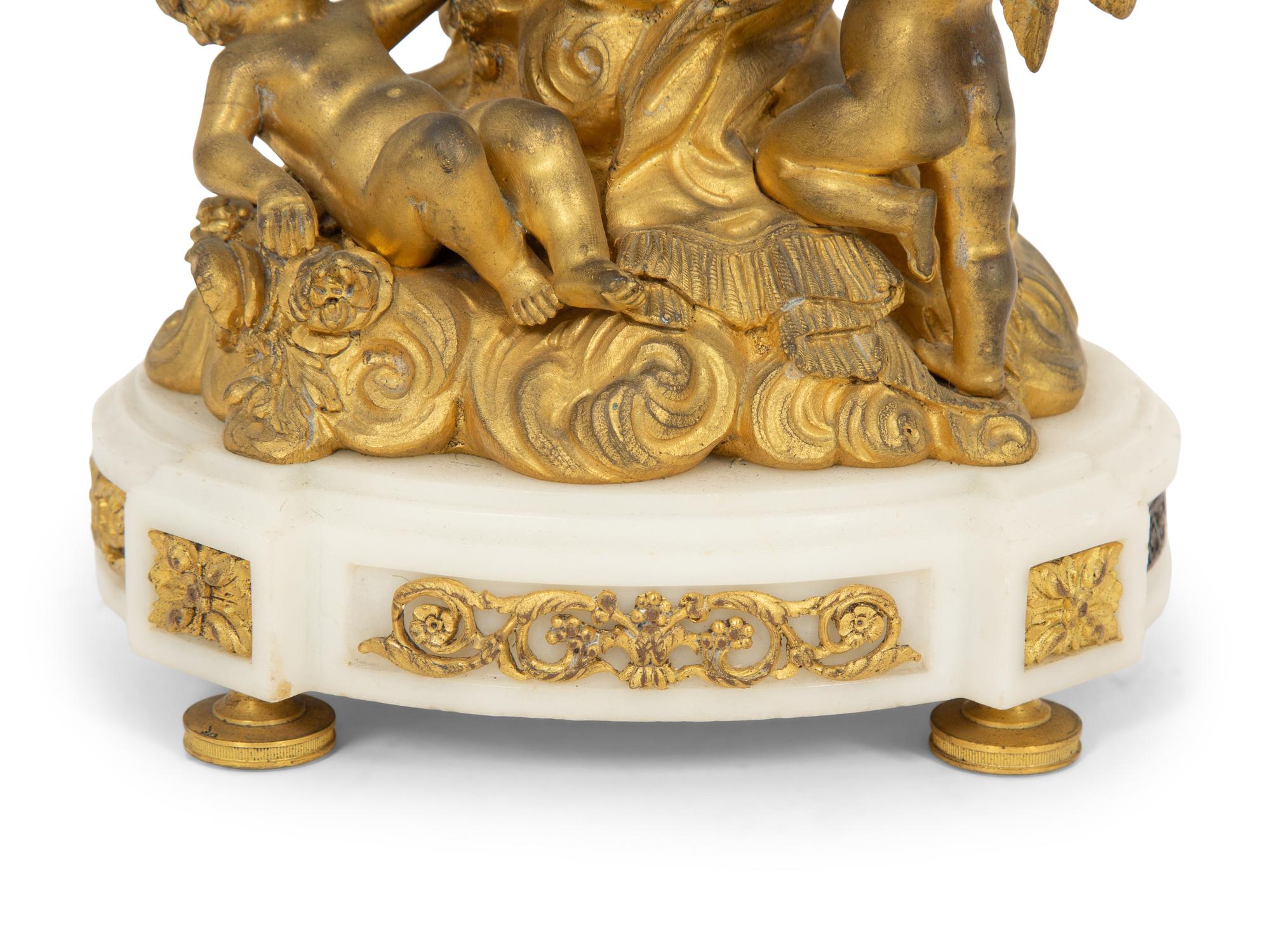 A French Gilt and Patinated Bronze Figural Clock