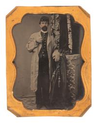 [CIVIL WAR]. Quarter plate tintype portrait of a soldier wearing a stable frock.