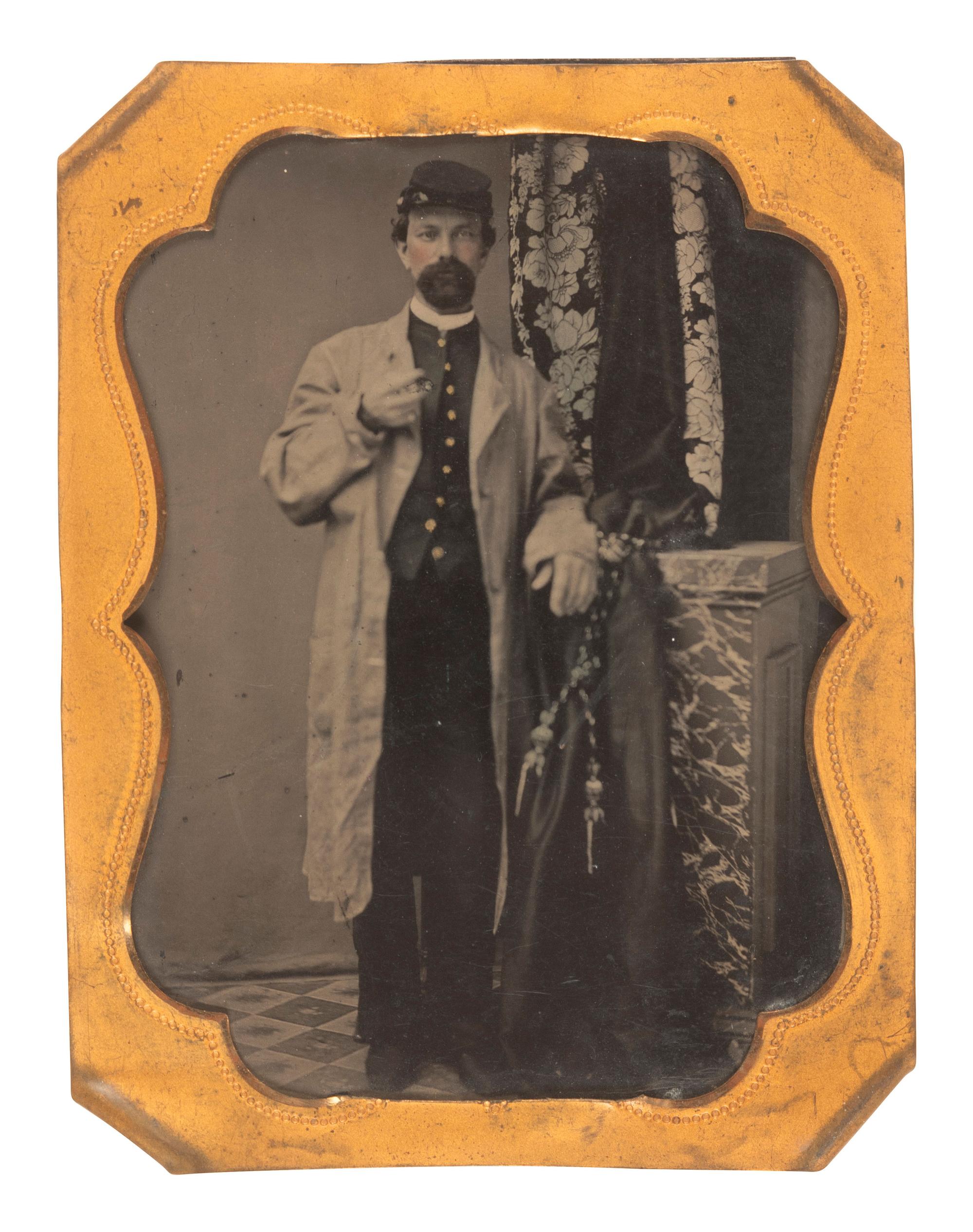 [CIVIL WAR]. Quarter plate tintype portrait of a soldier wearing a stable frock.
