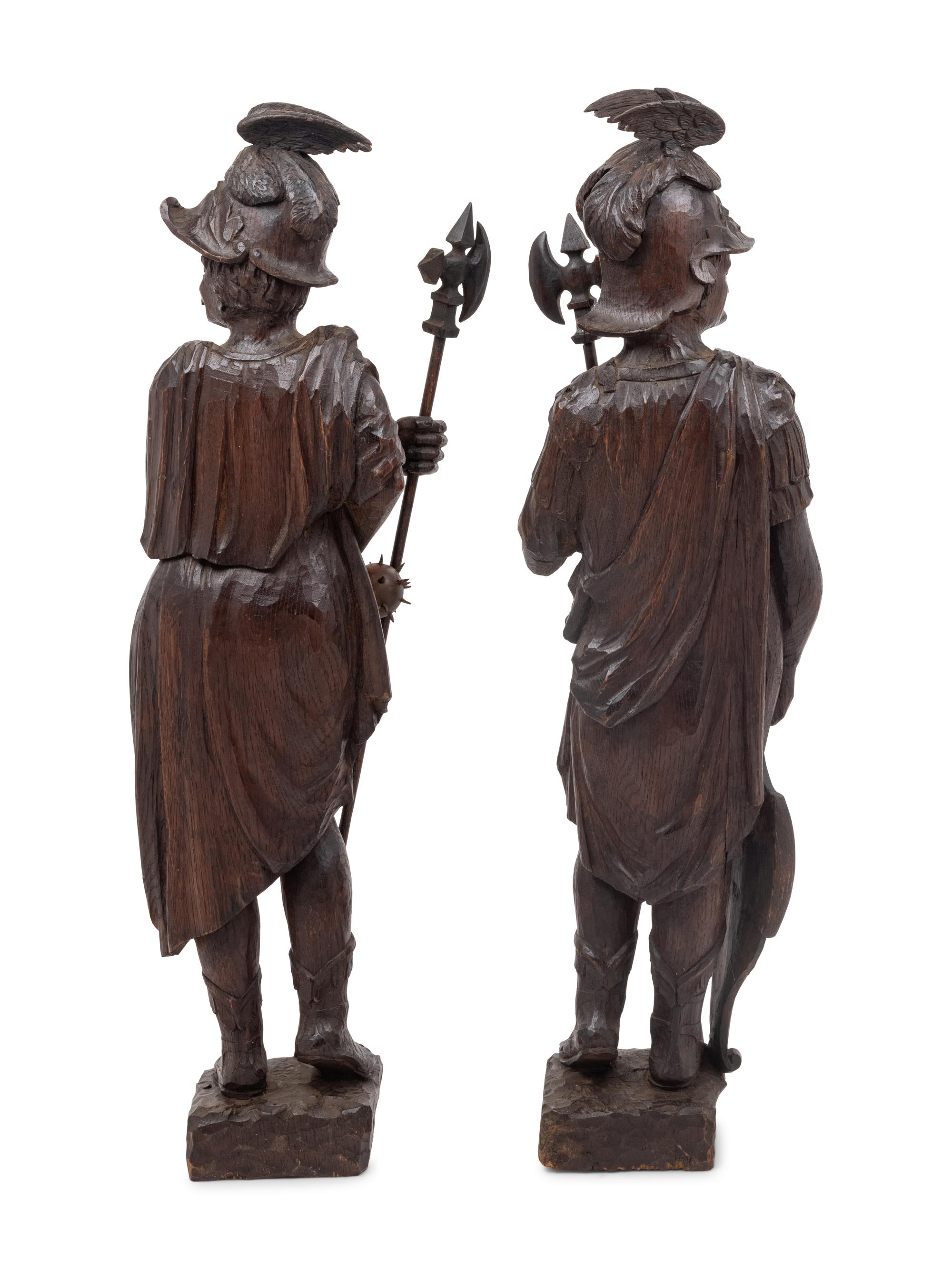 A Pair of Continental Carved Oak Figures of Knights