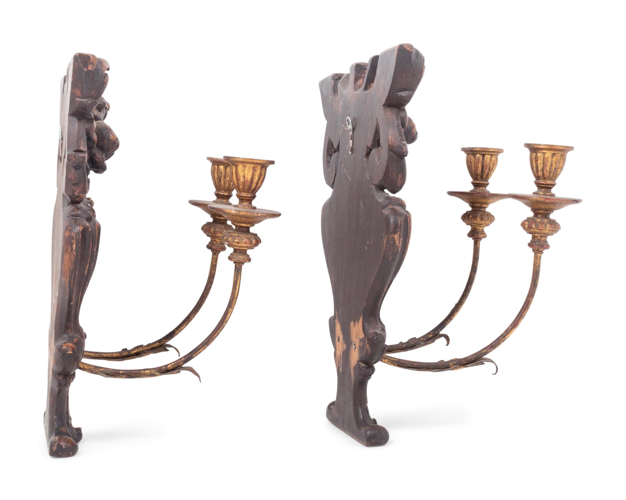 A Pair of French Carved Walnut and Giltwood Two-Light Sconces