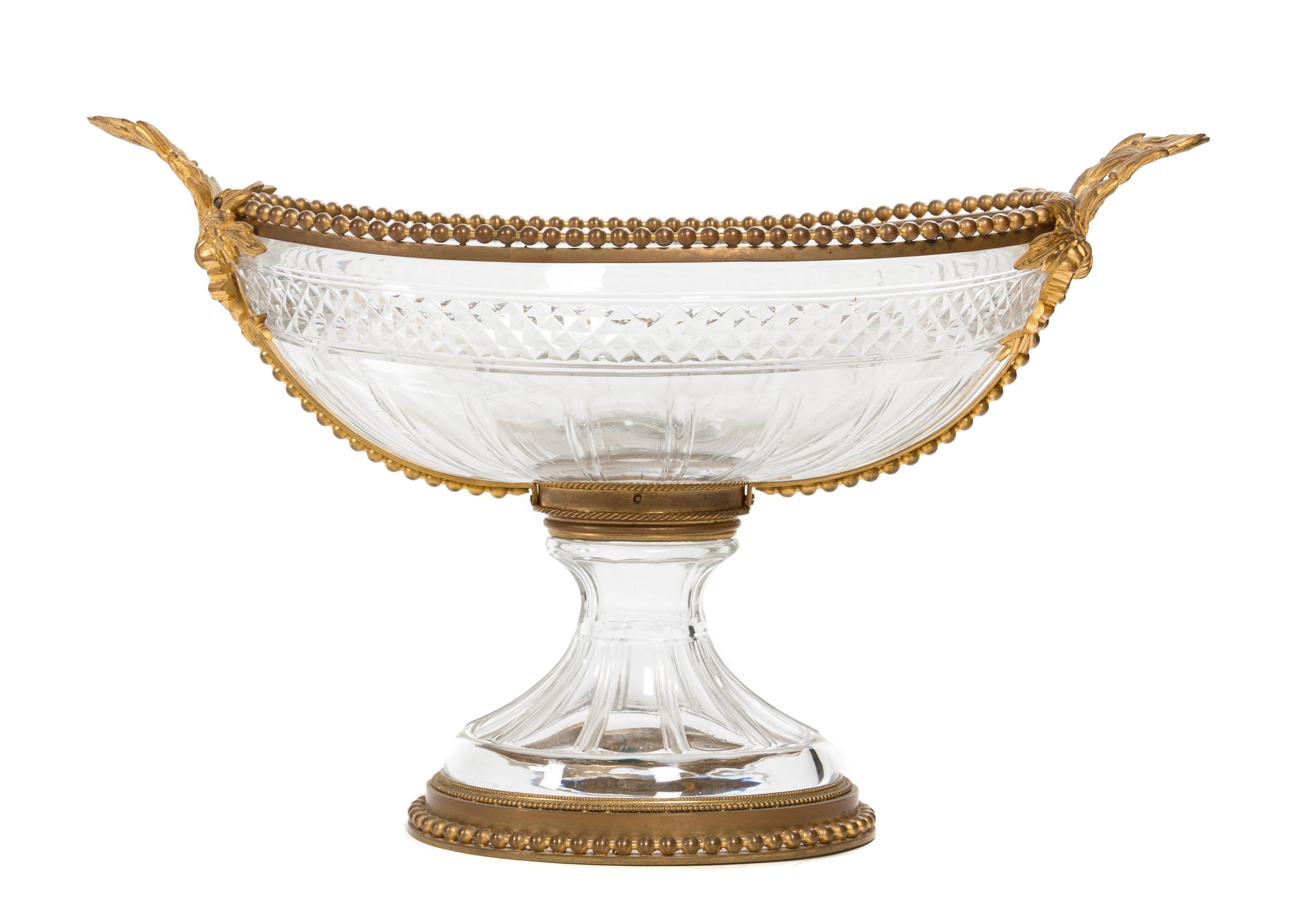 A Gilt Bronze Mounted Cut Glass Centerpiece Bowl Height 14 x width over handles 22 inches.