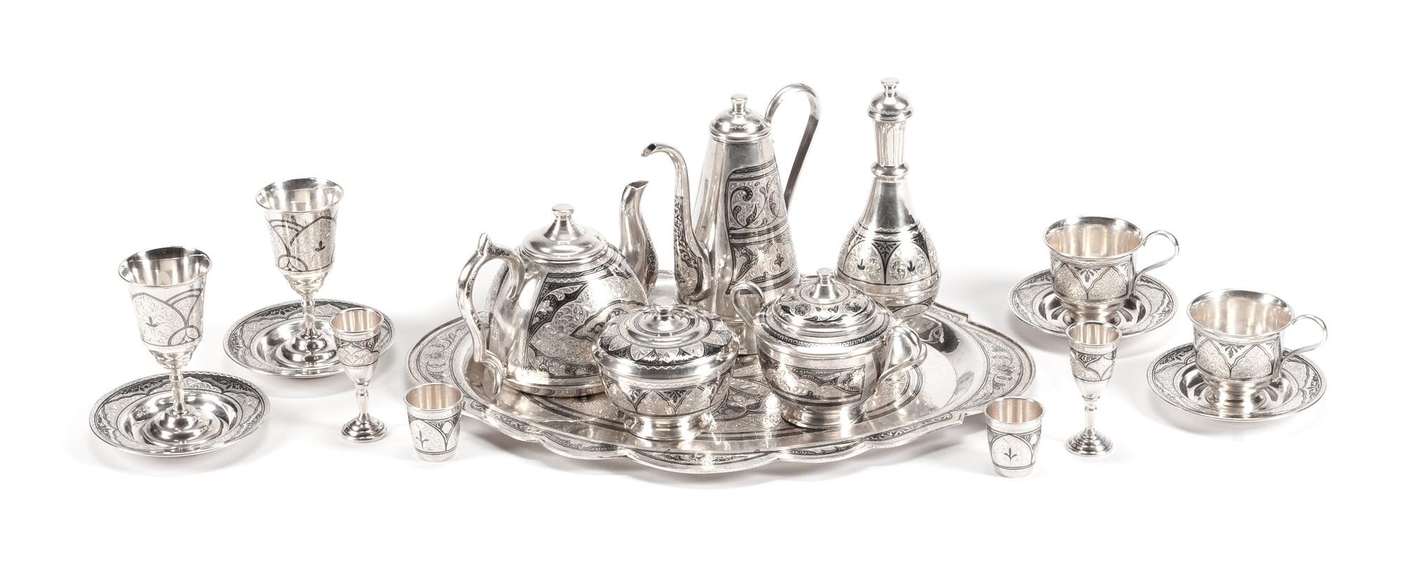 An Extensive Indian Silver-Plate Tea, Coffee and Dessert Service, Late 19th/Early 20th Century, comprising 2 coffee pots, 1 teapot, 2 c