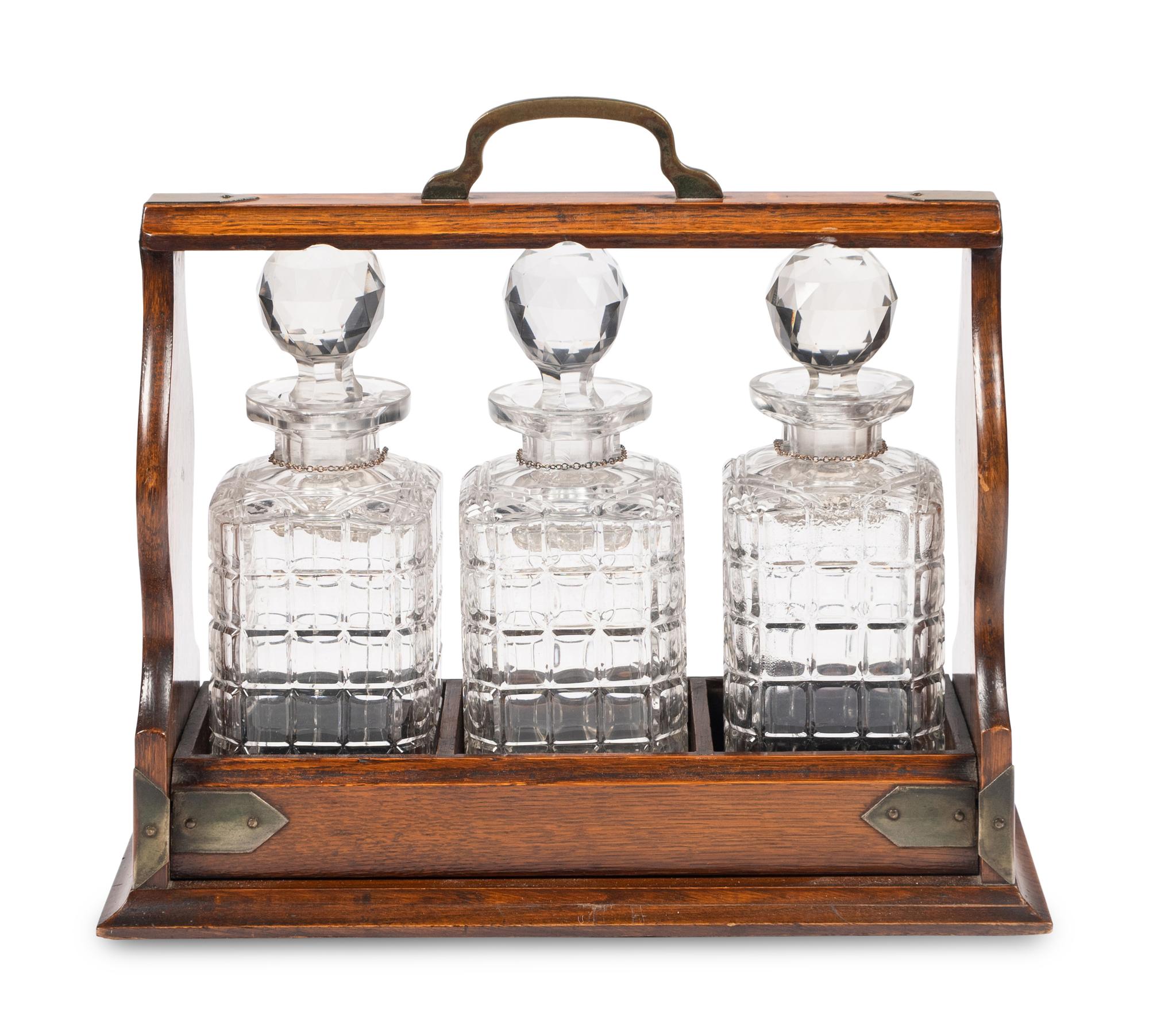 An English Oak and Cut Glass Tantalus