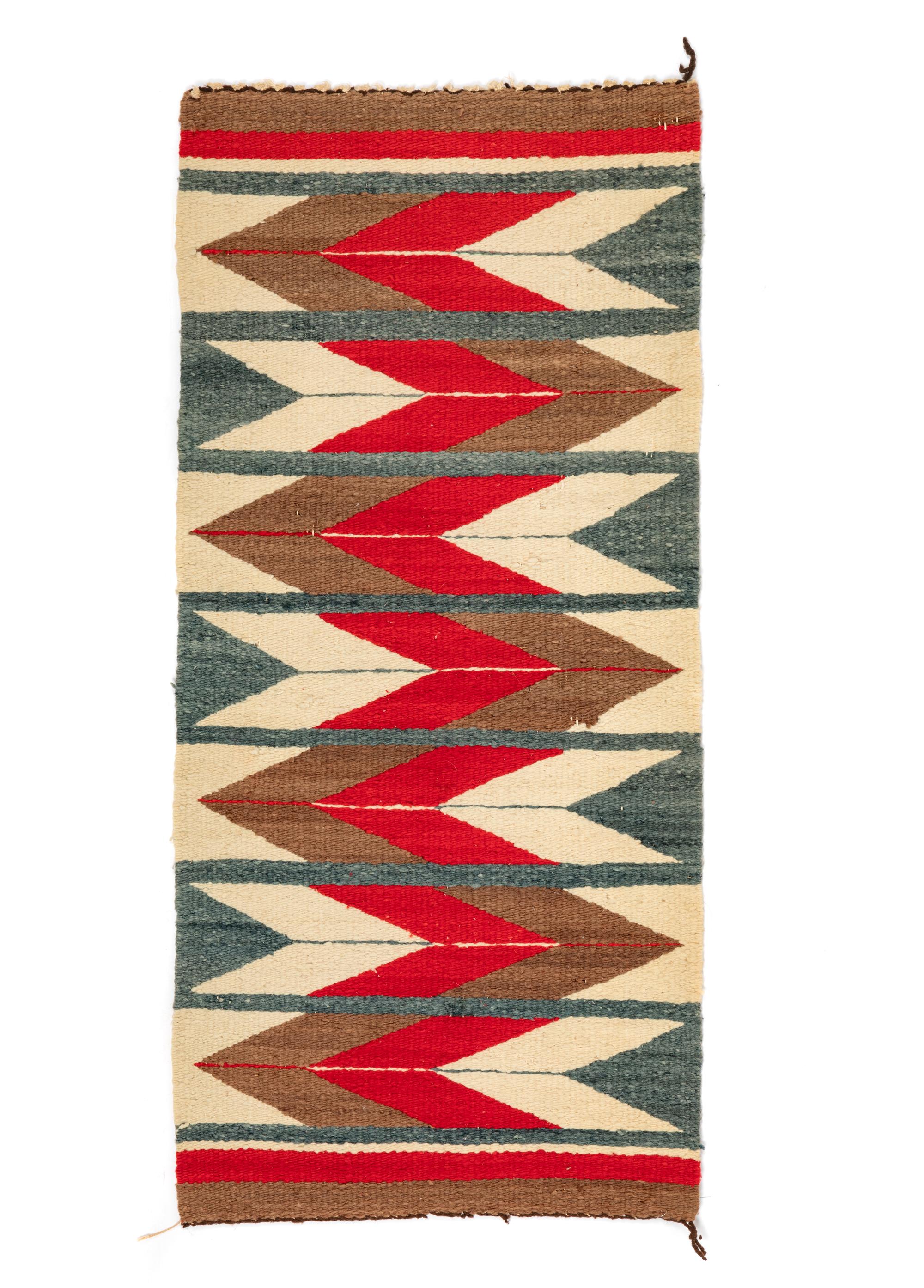 A Group of Navajo Weavings and Rugs