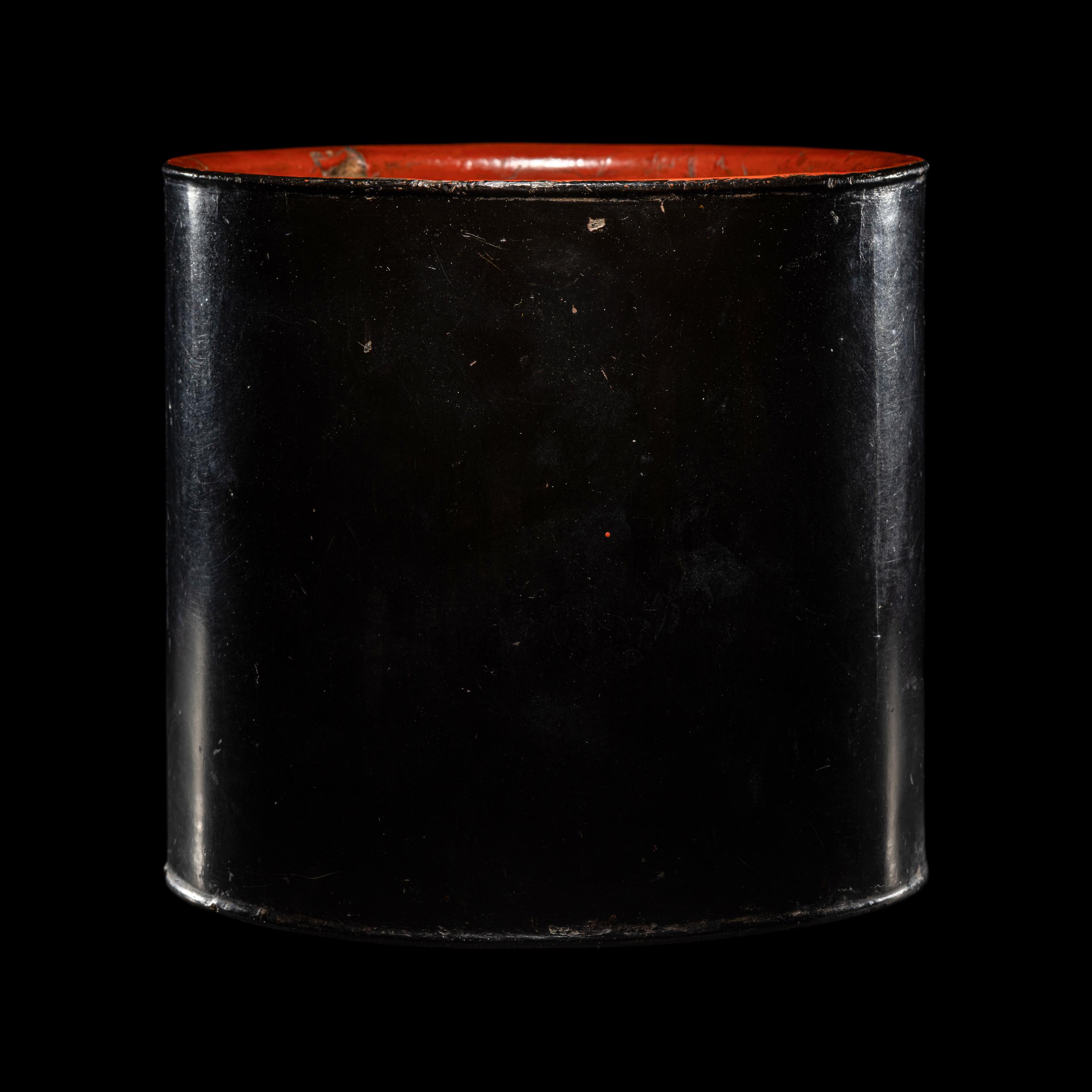 A Chinese Black and Red Lacquered Brushpot, Bitong, Wanli Mark 萬曆丙午（1606）款黑漆素面筆筒