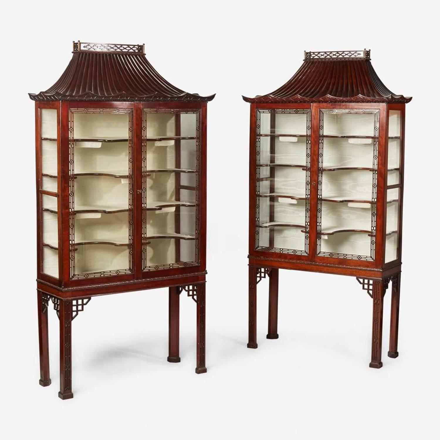 A pair of Chinese Chippendale style carved mahogany and glass display cabinets 20th century