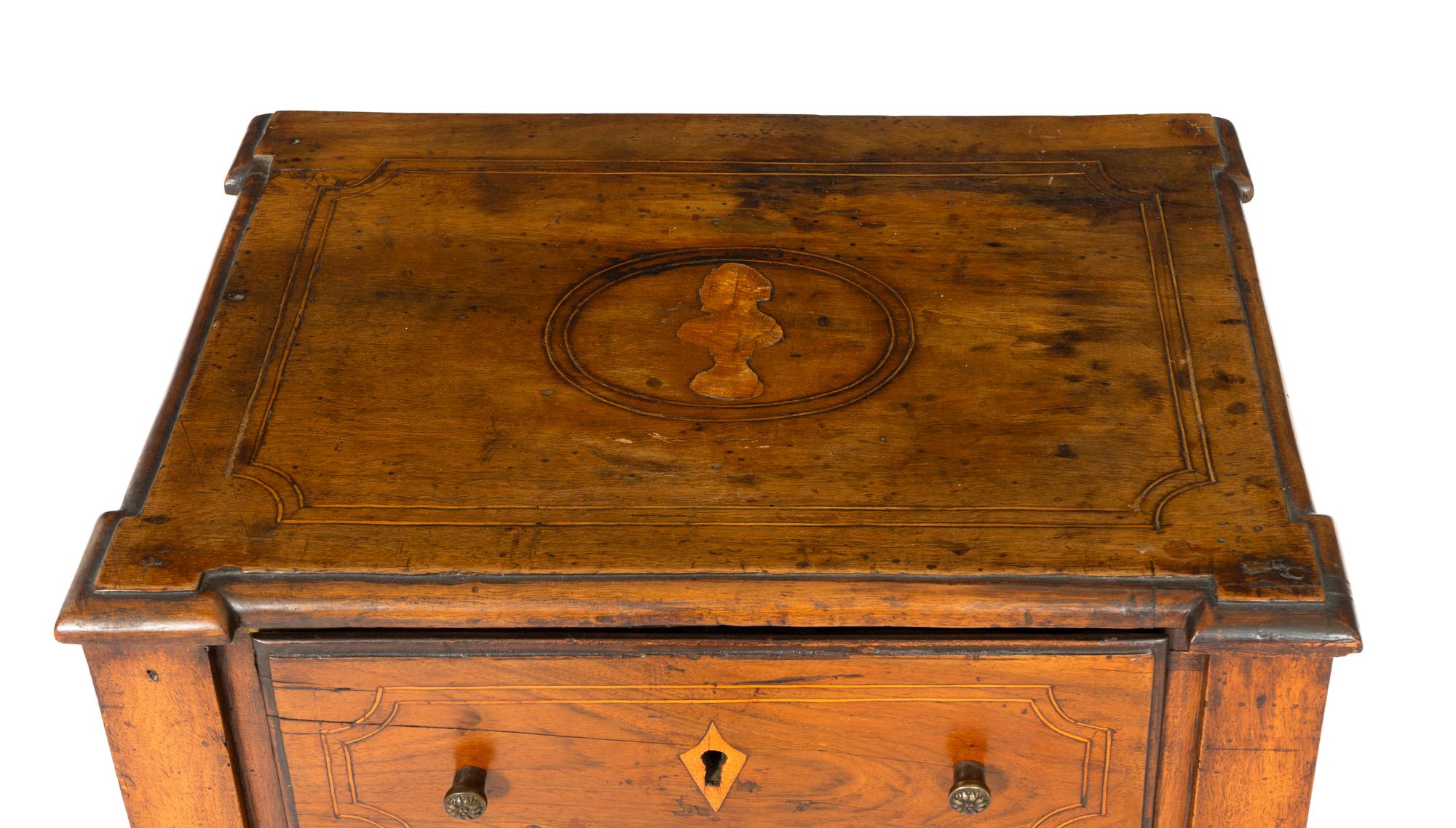 An Italian Walnut and Marquetry Commodino