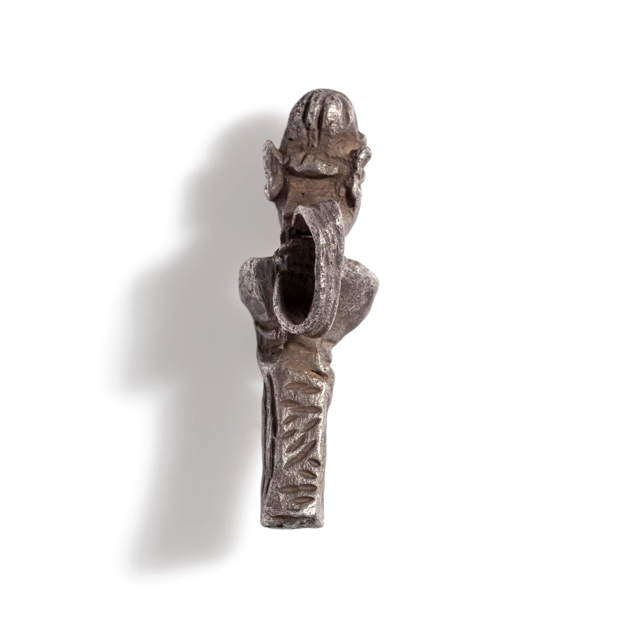 A Phoenician Silver Pendant of a Deity