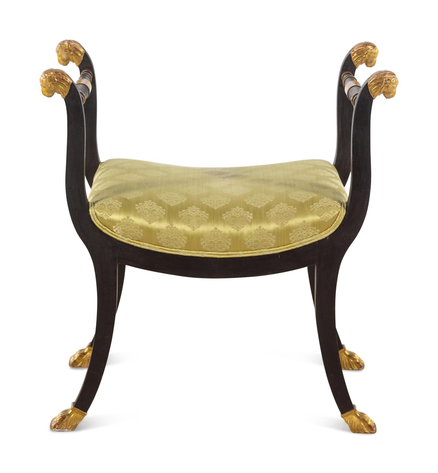 An Italian Parcel Gilt and Ebonized Curule Bench