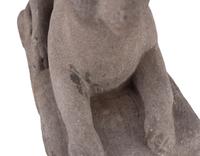 A Carved Stone Recumbent Dog, In the Manner of Edmondson