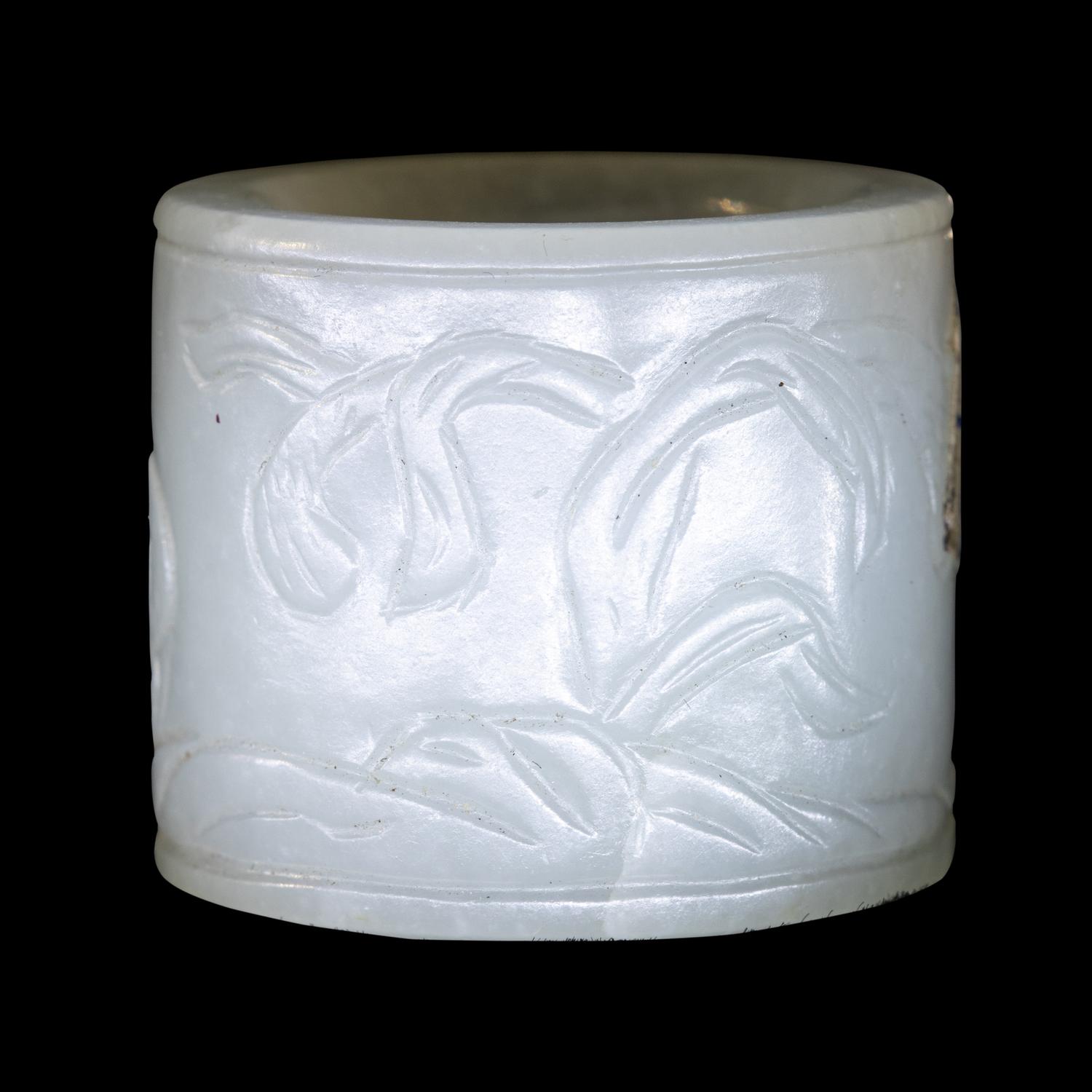 A Carved White Jade 'Double Quails' Archer's Ring