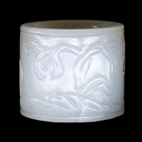 A Carved White Jade 'Double Quails' Archer's Ring