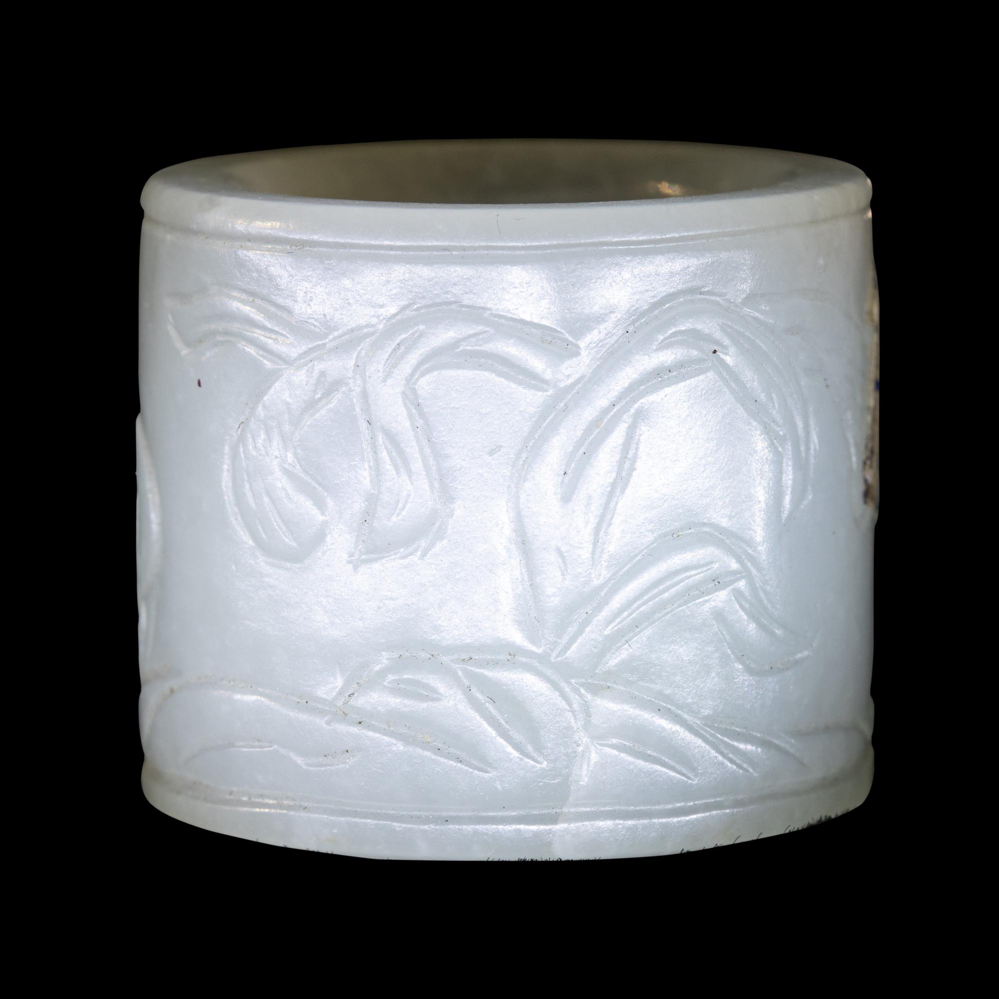 A Carved White Jade 'Double Quails' Archer's Ring