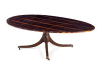 A Regency Style Macassar Ebony Oval Dining Table Top on an Associated Base