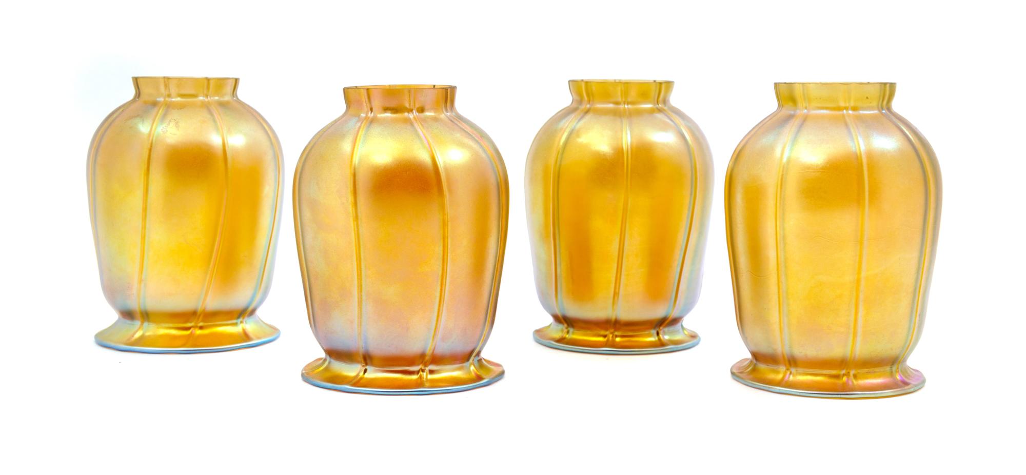 A Set of Four American Iridescent Glass Shades Height 5 1/4 inches.