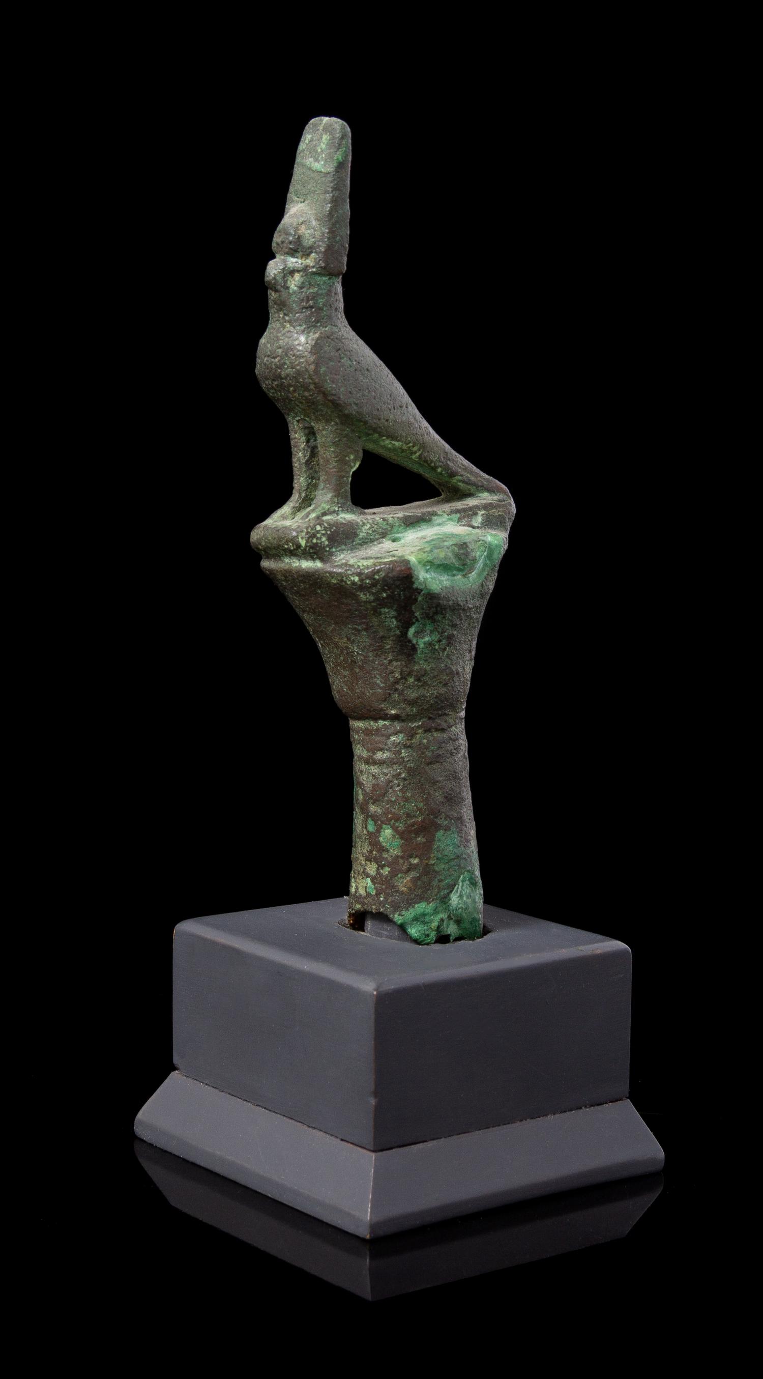 An Egyptian Bronze Horus Finial Height 4 1/4 inches. — LATE PERIOD TO PTOLEMAIC PERIOD, 664-30 B.C.E.