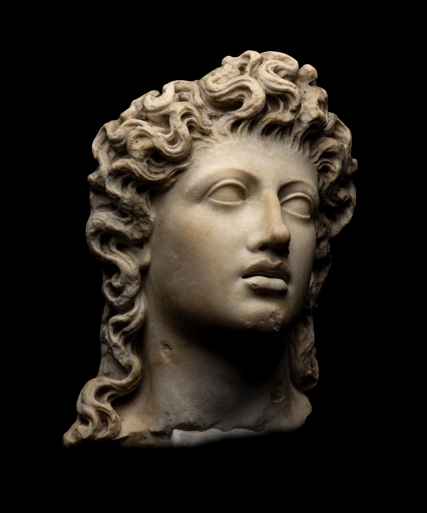 A Roman Marble Head of a Triton