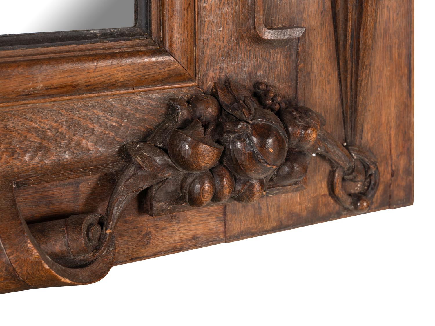 A Continental Carved Oak Mirror