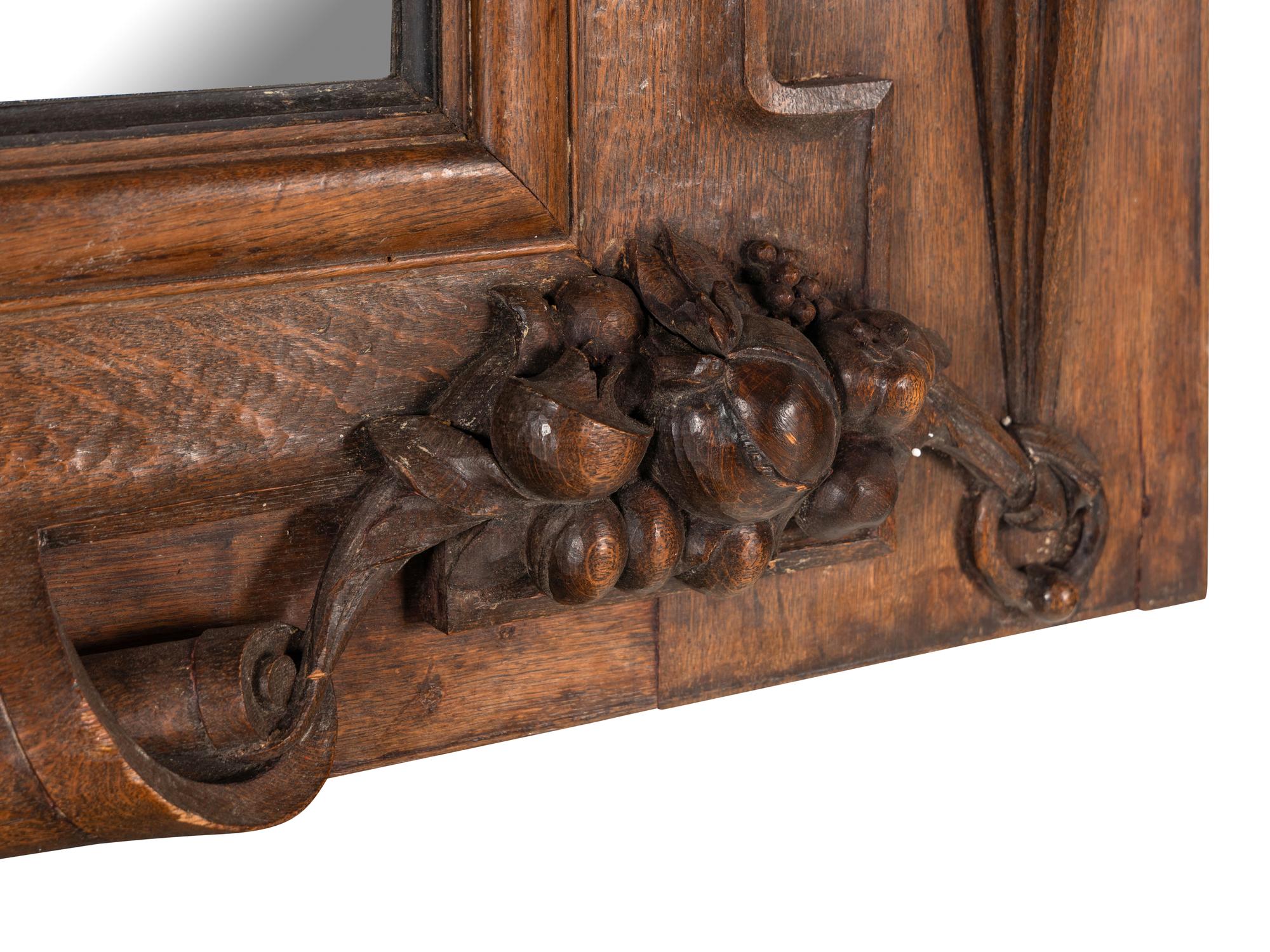 A Continental Carved Oak Mirror