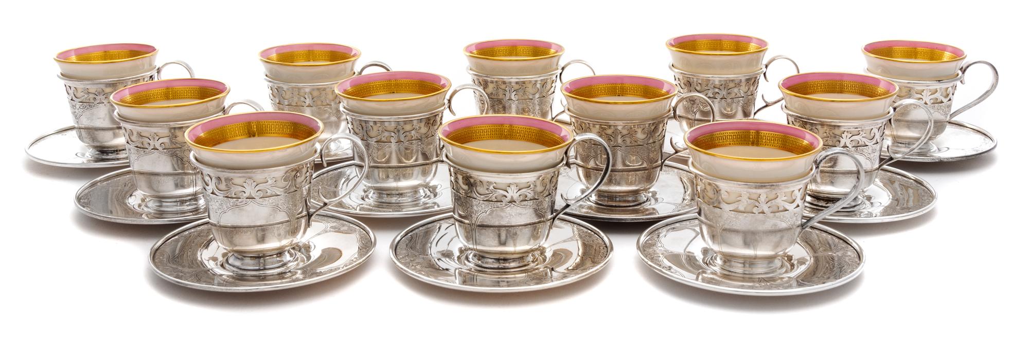 A Set of Twelve American Silver-Lined Porcelain Coffee Cups, Barbour Silver Co., Hartford, CT, each Lenox porcelain bowl with a pink an