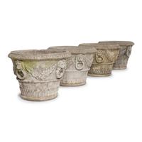 A Set of Four Cast Stone Jardinières