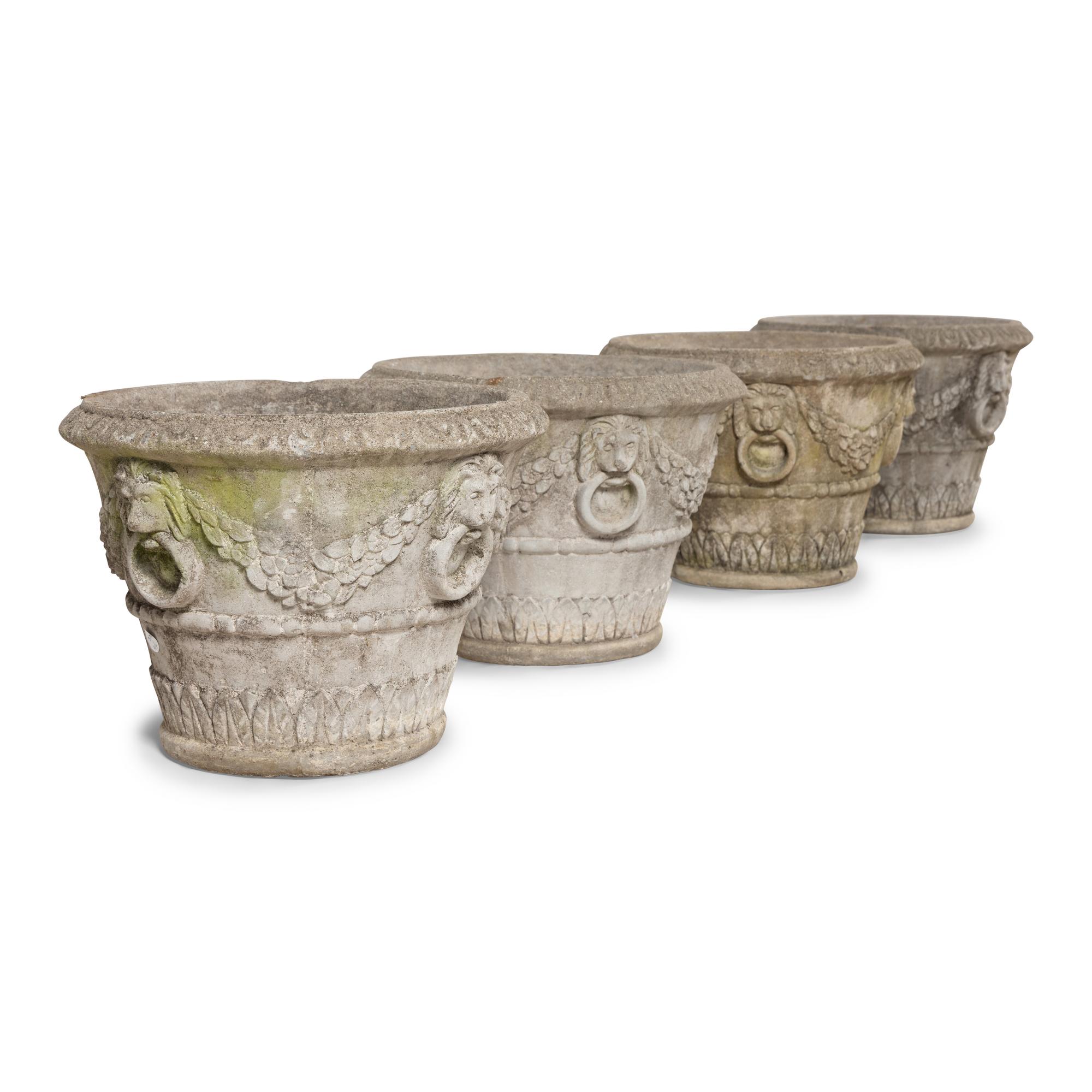 A Set of Four Cast Stone Jardinières