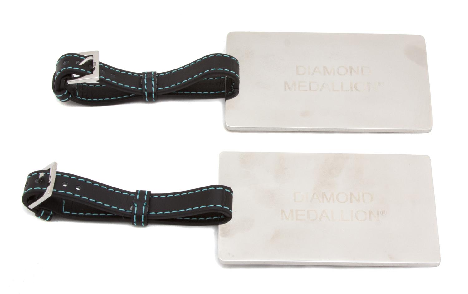A Pair of Tiffany & Co. Silver Luggage Tags, Strap: 9"; Tag: 4" x 2.5".